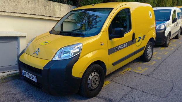 Roquebrune-Cap-Martin, France - October 30 2015: Yellow Citroen Nemo Combi, Car of the French Post Service "La Poste", Parked Waiting to Deliver the Mail in Roquebrune-Cap-Martin, French Riviera
