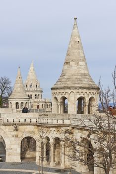 BUDAPEST, HUNGARY - FEBRUARY 02: Tourists walking around Fisherman's Bastion spires, one of the attractions at the Old Town district. February 02, 2016 in Budapest.