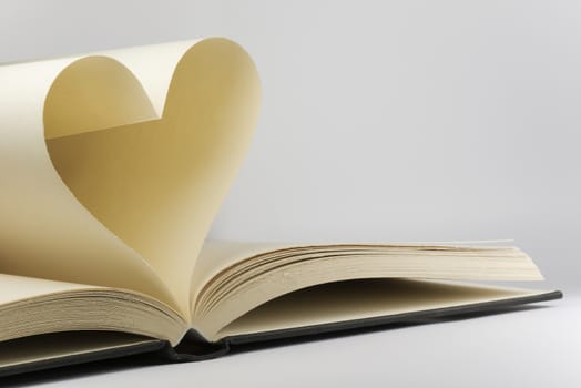 Book with two pages in a heart shape
