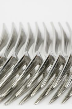 Abstract collection of metal forks
