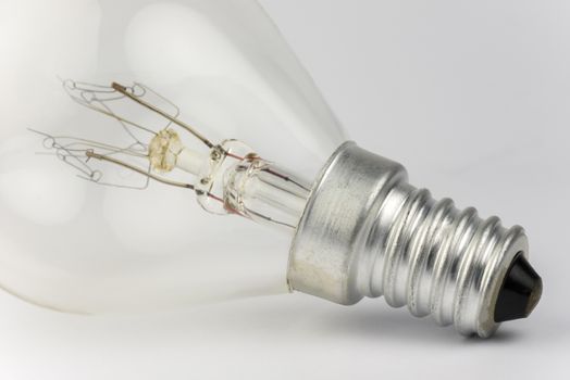 Old light bulb with artfully shaped filaments
