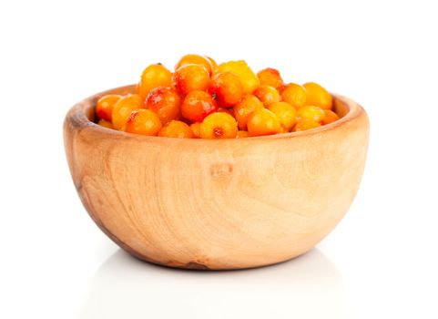 Fresh sea buckthorn berry in a wooden bowl