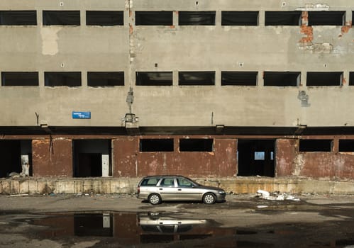 discarded ruin with old windows and wall, industrial window in concrete wall