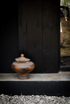 Pottery drinking water jar from northen thailand background