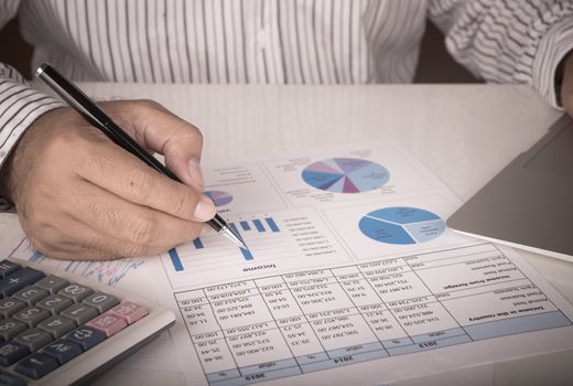 businessman analyzing data report. Vintage Style.