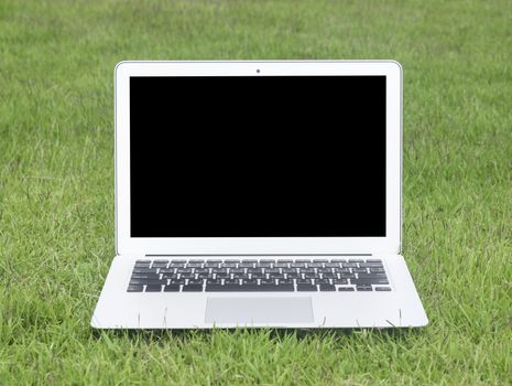 laptop computer in the home garden. technology concept, freelance concept, business concept. Selective focus.