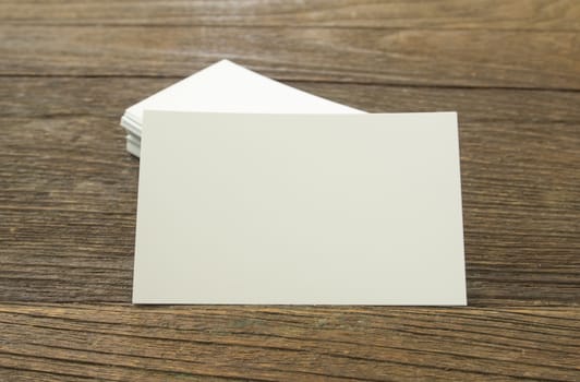 business card placed on a wooden table.
