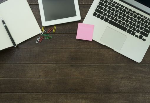 book ,notebook, laptop ,pen on wooden table