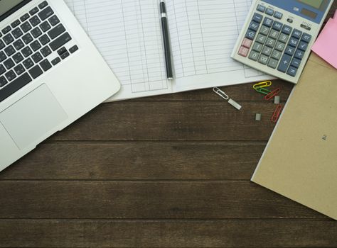laptop,Calculator,account book, on desk.working concept