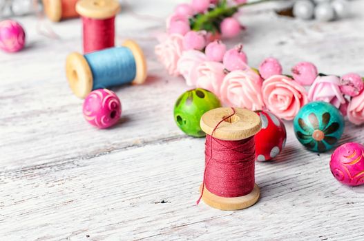 Beads,thread and other sewing accessories in the manufacture of ornaments wreath on his head