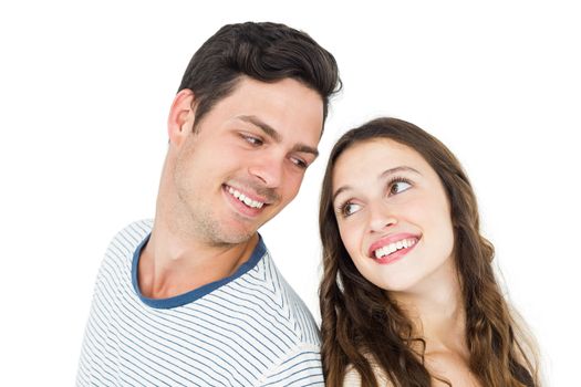 Couple standing back to back on white background