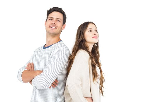 Couple standing back to back on white background