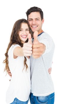 Couple with thumbs up on white background