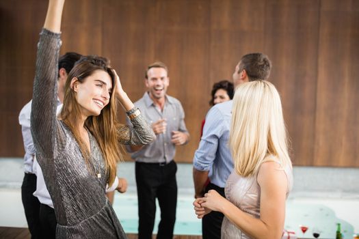 Group of young friends dancing at the party