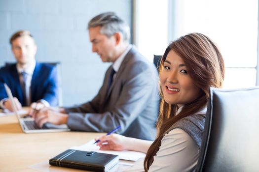 Confident businesswoman in a conference room during meeting at office