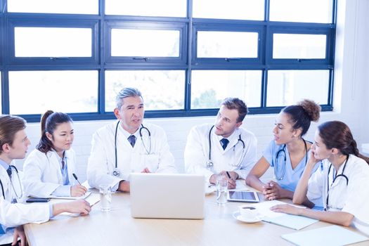 Medical team discussing in meeting at a conference room