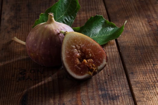 close up view of fresh figs on color back