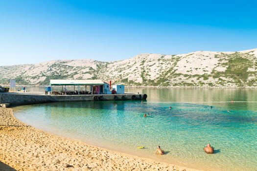 RAB, CROATIA - CIRCA AUGUST 2015: The pristine coastline and crystal clear water of the island of Rab, Croatia.