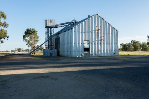 Grain store set against a blue sky.