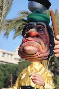 Nice, France - February 21 2016: Caricature of Muammar Gaddafi (Colonel Gaddafi). Parade Float during the Carnival of Nice (Corso Carnavalesque 2016) in French Riviera. The Theme for 2016 was King of Media