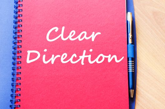 Clear direction text concept write on notebook with pen