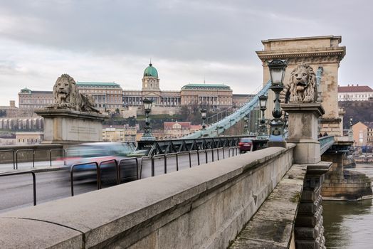 BUDAPEST, HUNGARY - FEBRUARY 02: Motion blurred traffic over Széchenyi Chain Bridge with Buda Castle in the background. February 02, 2016 in Budapest.