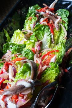 salad with fisn fresh vegetables onion lattice and pepper