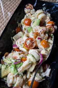 salad with fresh tomatoes cherry shrimps macaroni and lettuce