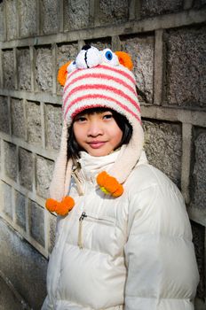 Portrait of cute fashionable children in overcoat on winter.