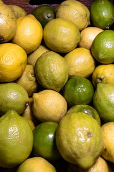 stack of fresh lemons and limes