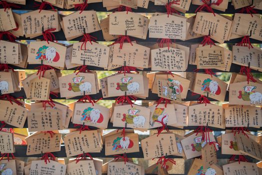 Kyoto, Japan - November 6, 2015: Dragon wooden prayer tablets at Kiyomizu dera - Kyoto. Pray for happieness, healthy, luck by write a word on wooden tablet.