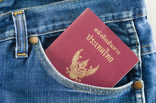 Thai passport coming out of jeans pocket.