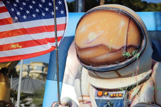 Nice, France - February 21 2016: Caricature of American Astronaut with American Flag. Parade Float during the Carnival of Nice (Corso Carnavalesque 2016) in French Riviera. The Theme for 2016 was King of Media