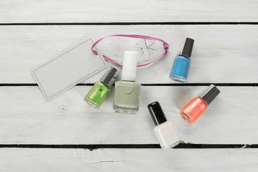 Cosmetics on a wooden background with a price tag