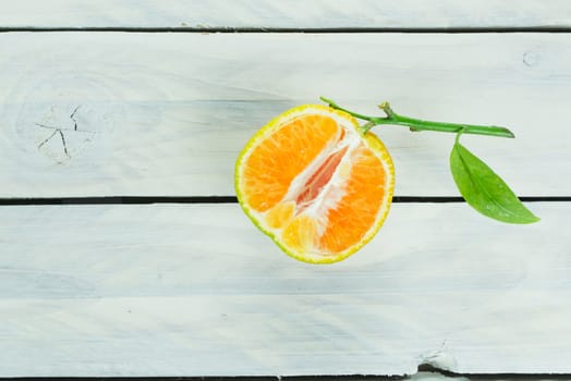 Citrus fruit cutted in half on a wooden table
