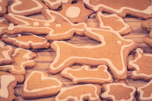 Xmas cookie figures in various shapes on wood