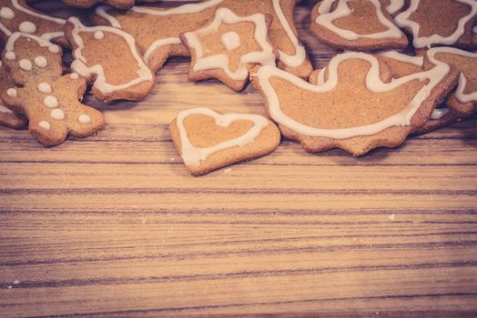 Christmas cookies in many shapes on a wooden background