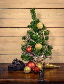 Xmas ornament with shiny baubles under a Christmas tree