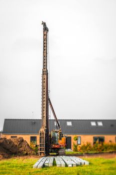 Industrial piling machine in a single family neighborhood