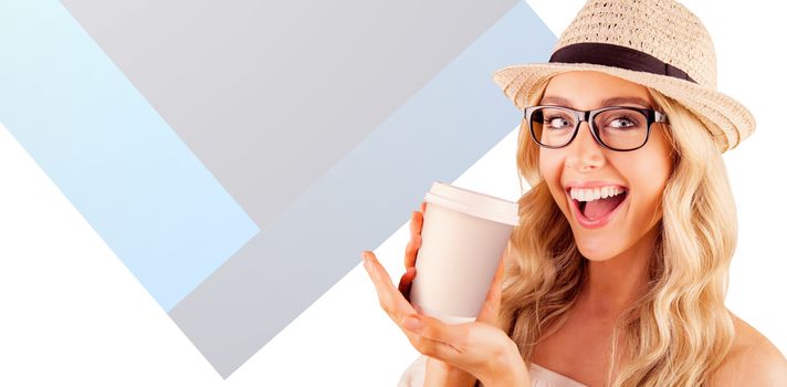 Gorgeous smiling blonde hipster presenting take-away cup against yellow background
