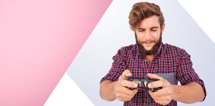 Hipster playing video game against pink background