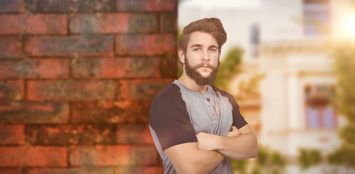 Portrait of confident hipster against wall of a house