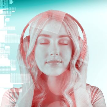 Close up of a woman listening to music  against skyscraper