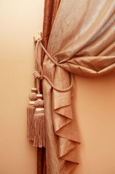 Home interior fragment. Closeup of nice vintage curtain with lace