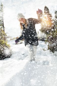 Portrait of young beautiful woman on winter outdoor background
