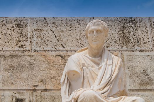 Athenian playwright of the New Comedy, in front of retaining wall of the auditorium at the east side of the Theater of Dionysos. Sky in the background.