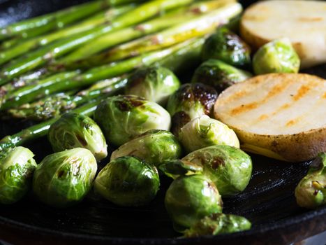 close up view of nice fresh vegetables is being fried