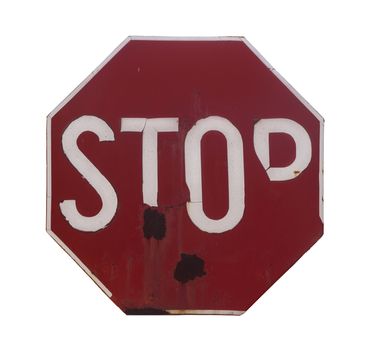 Front view of a rusted red stop sign with the word stop written isolated on white background