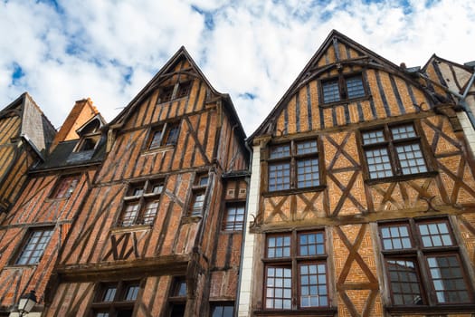 Facades of picturesque half-timbered houses in the city of Tours, France.