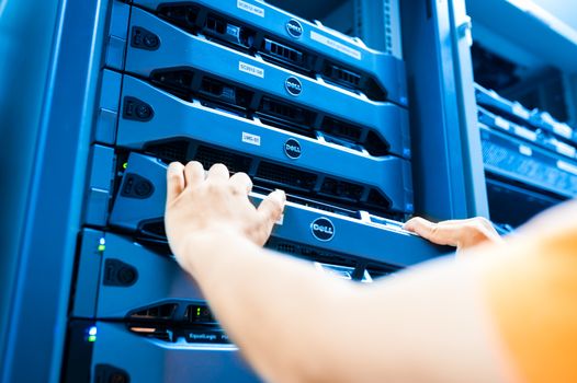 People fix server network in data room .